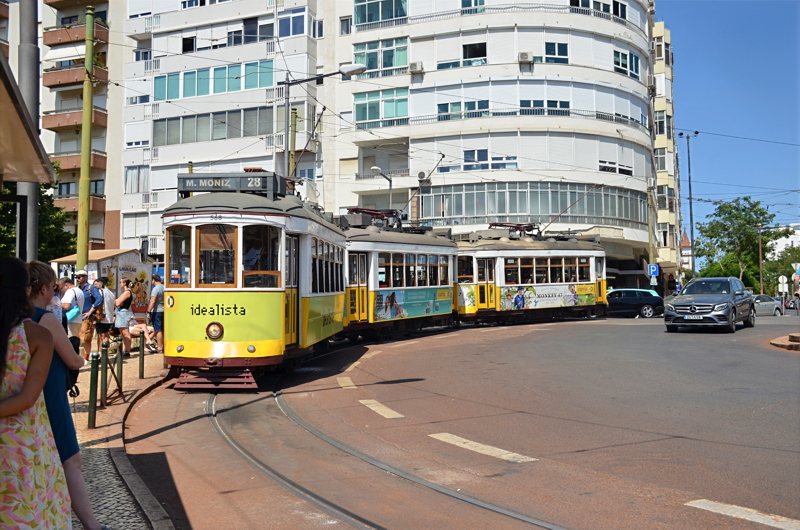 6 - Iconic vintage yellow trams (known locally as eléctricos, specifically the classic Remodelado series from the 1930s) operating on Line 28 in Lisbon